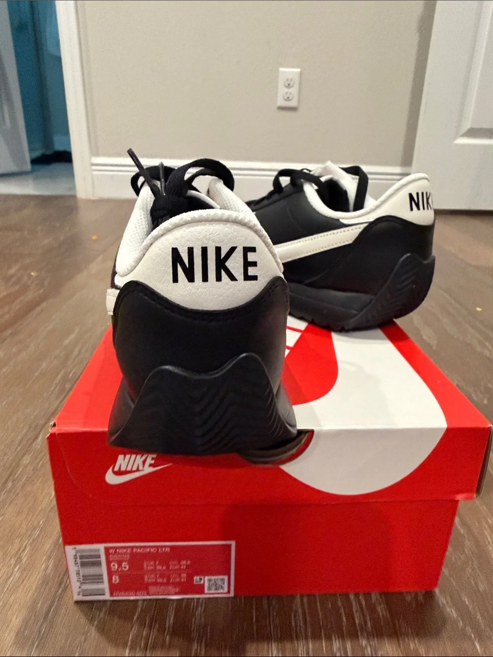 Nike Women's Black with White Swoosh Low-Top Sneakers